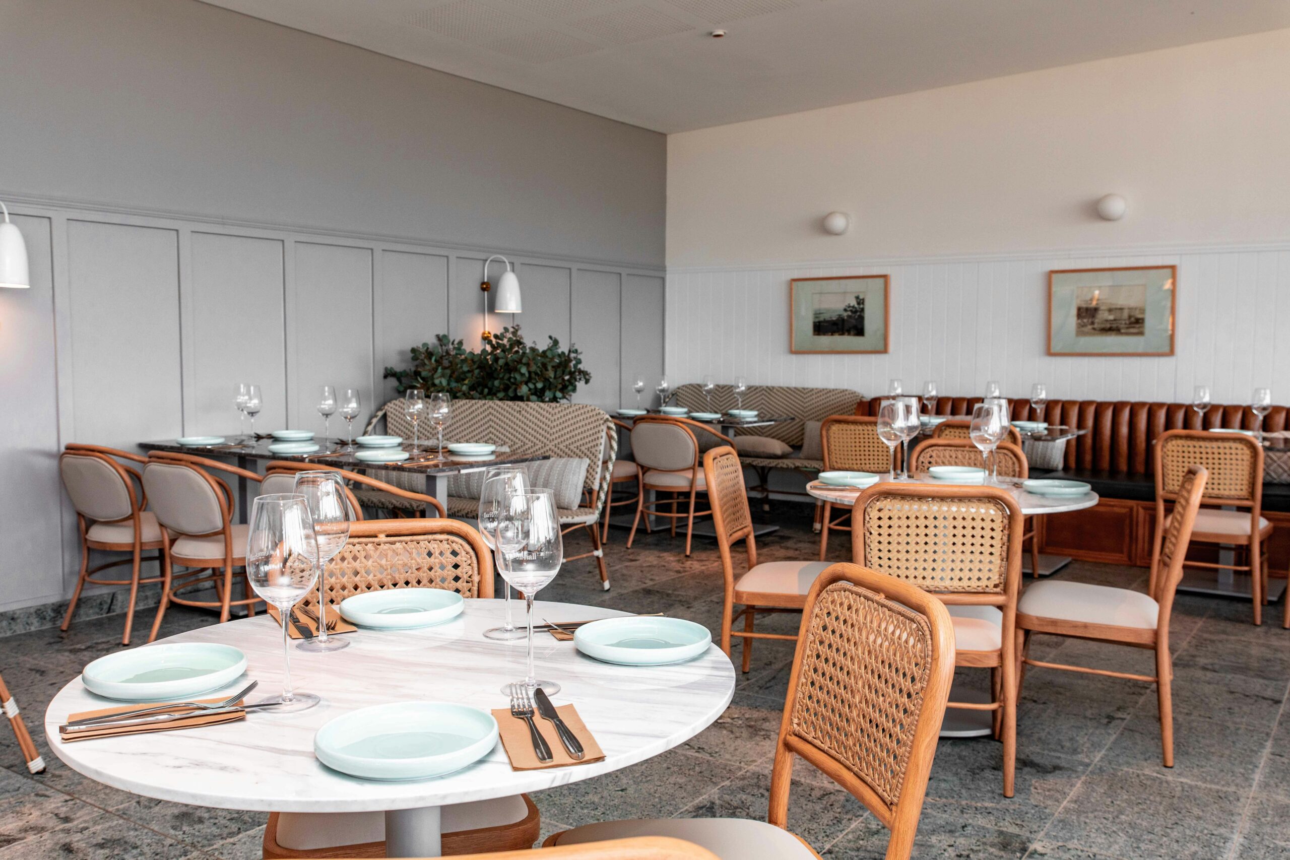 Elegant dining room featuring modern table settings and stylish furniture.